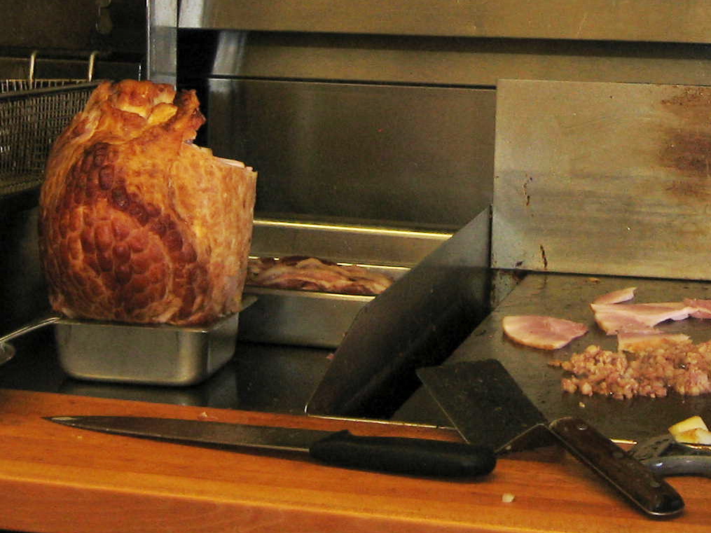 That's what bone-in ham looks like. To slice it, stand it up in a small tub or pot to hold the bottom steady and cut in slices from the meatiest edge toward the bone. 